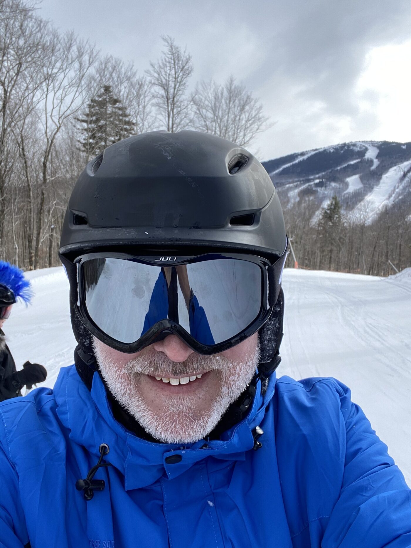 Daniel Kaufman skiing on a mountain trail