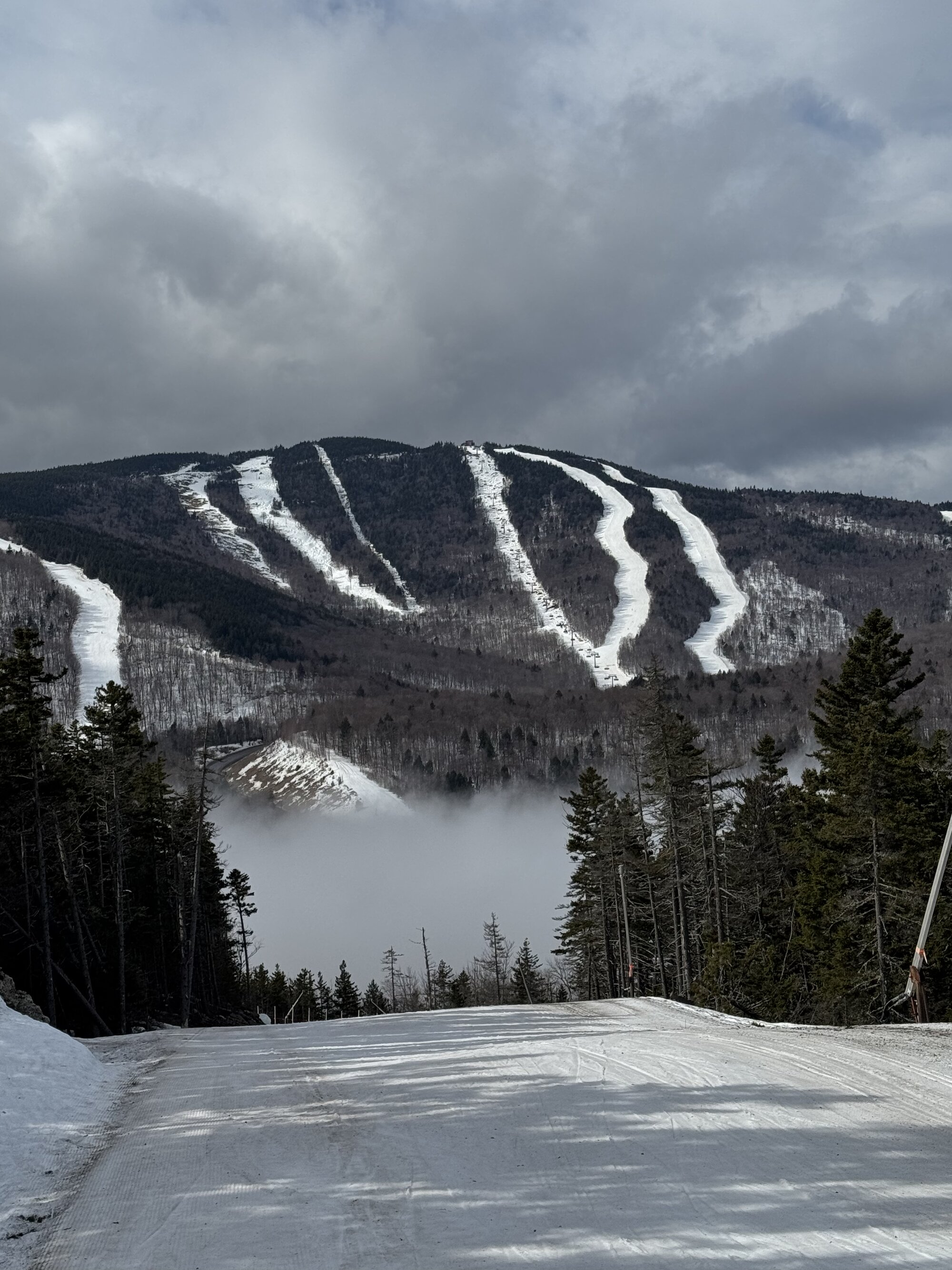 Mountain ridgelines rising above the clouds