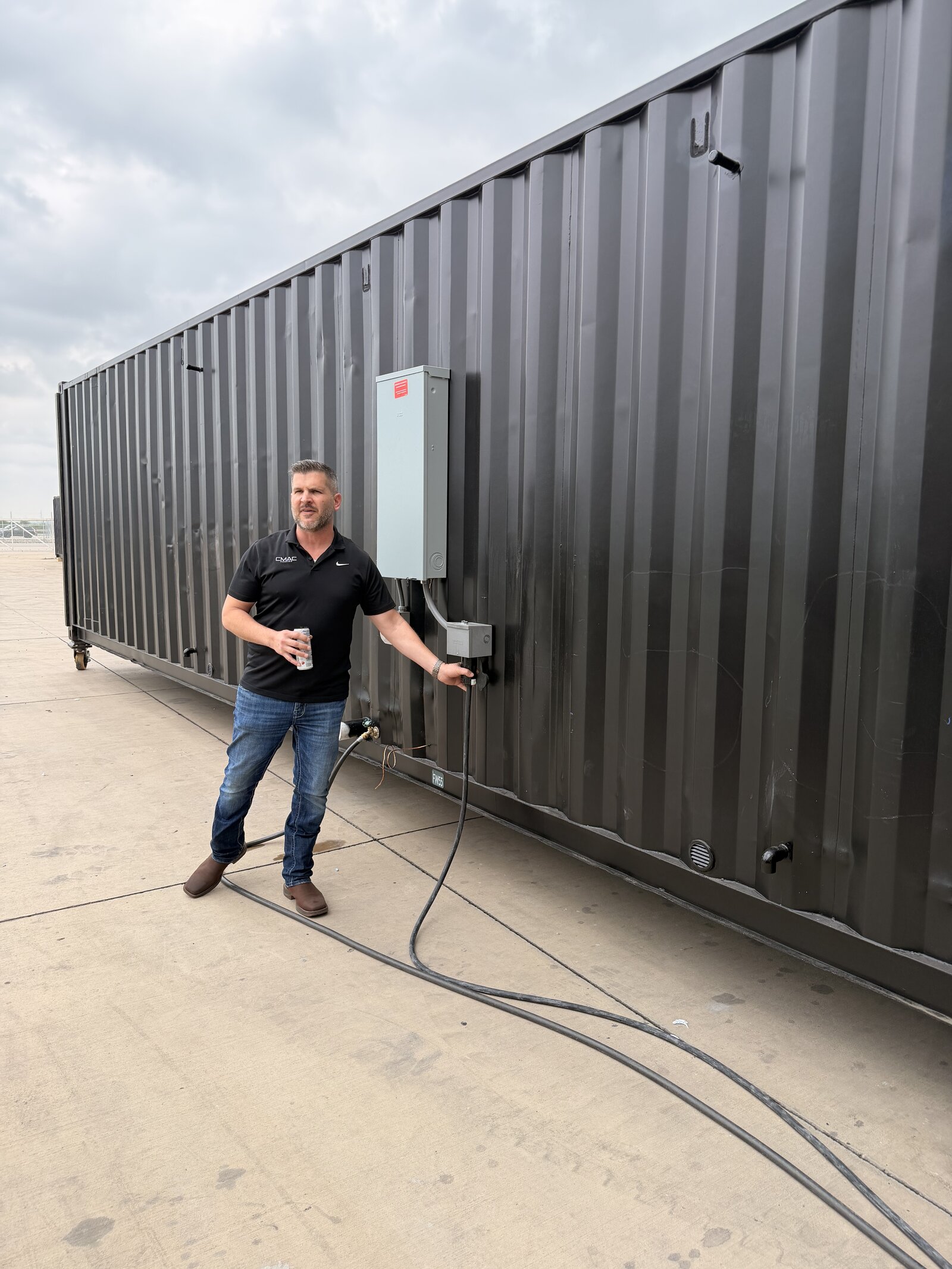 Electrical hookup being installed on a Mr. Good Container Homes unit